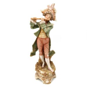 porcelánová soška značky Royal Dux, model: muž s píšťalou, bronz dekor se zlacením