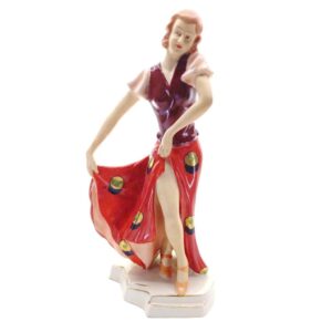 porcelánová soška značky Royal Dux, model: Art deco dívka v červených šatech, červený dekor se zlacením