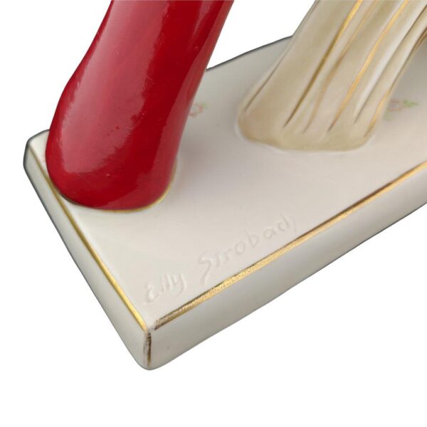 porcelánová soška značky Royal Dux, model: Sedlák se stohem slámy, červený dekor se zlacením, signatura