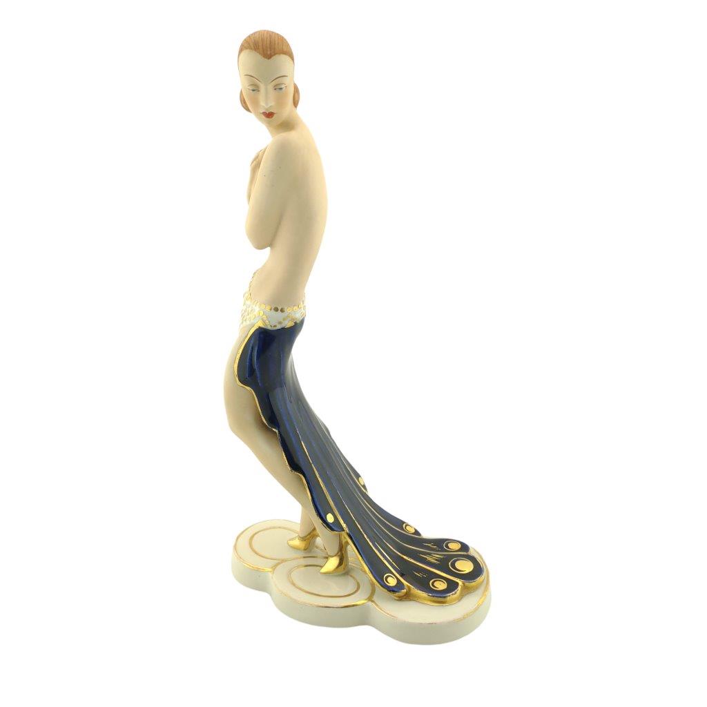 Porcelánová figura značky Royal Dux, model 3288 - Art deco dáma s pavími oky, kobaltový dekor se zlacením