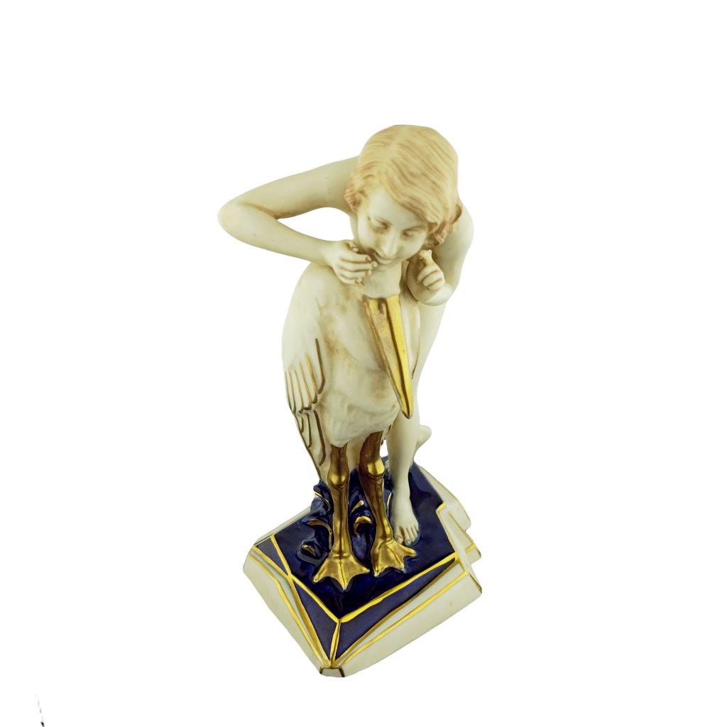 porcelánová figura značky Royal Dux, model: dívka s čápem, kobaltový dekor se zlacením