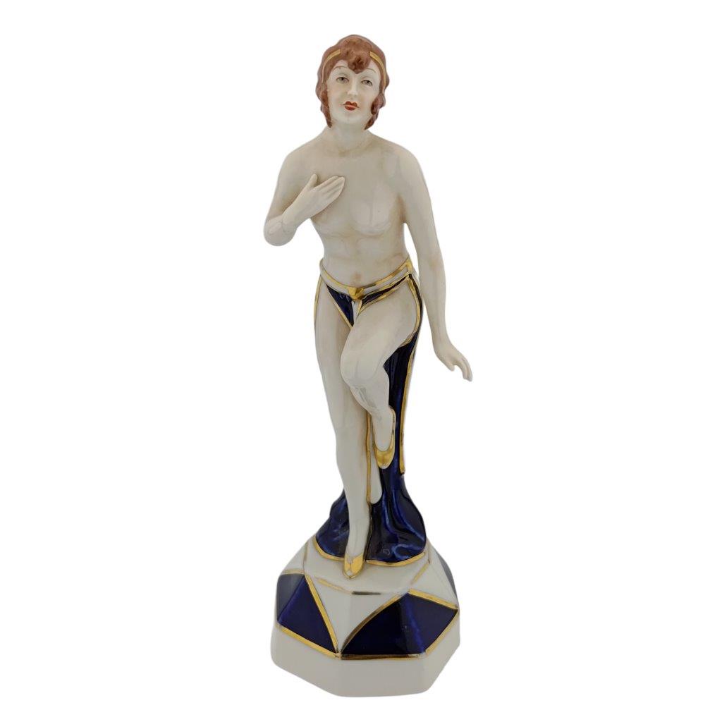 porcelánová figura značky Royal Dux, model: art deco dívka se zvednutou nohou, kobaltový dekor se zlacením