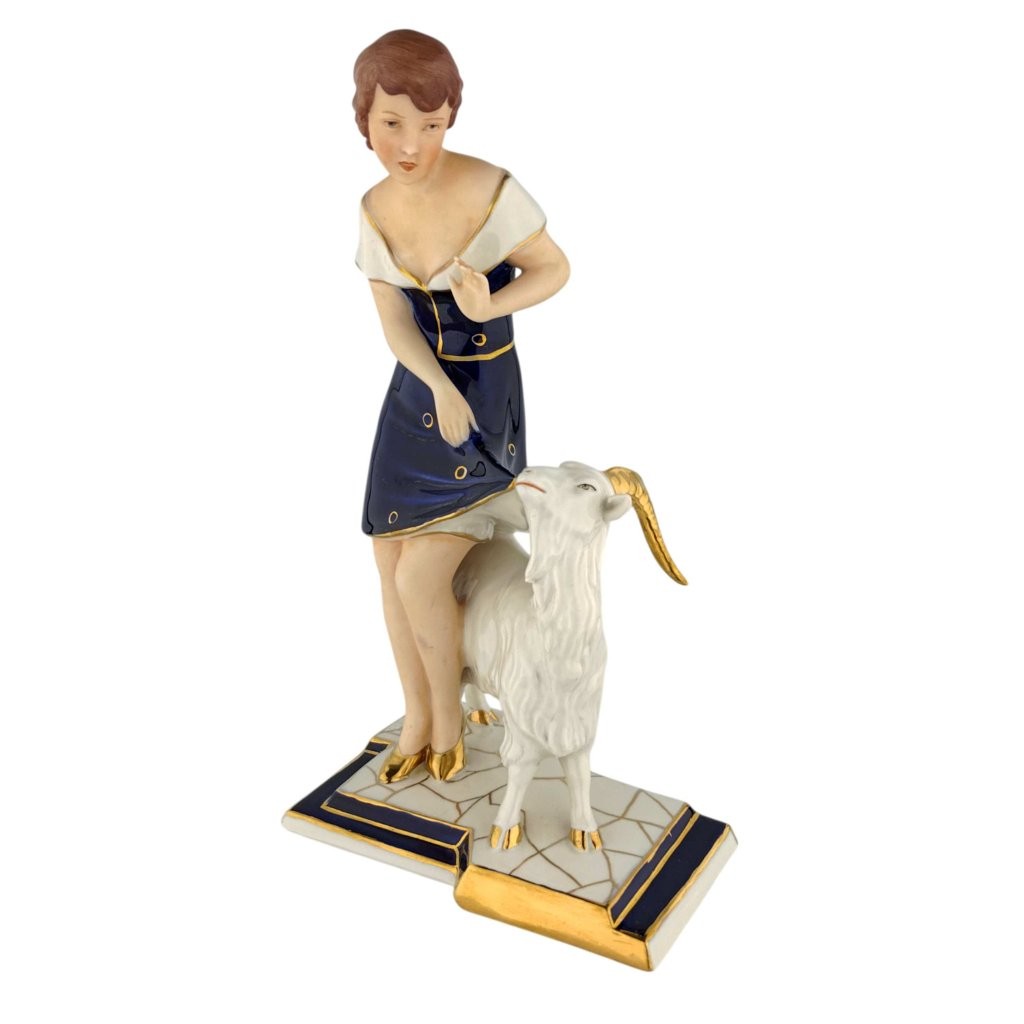 porcelánová figura značky Royal Dux, model: Dívka s kozlem, kobaltový dekor se zlacením